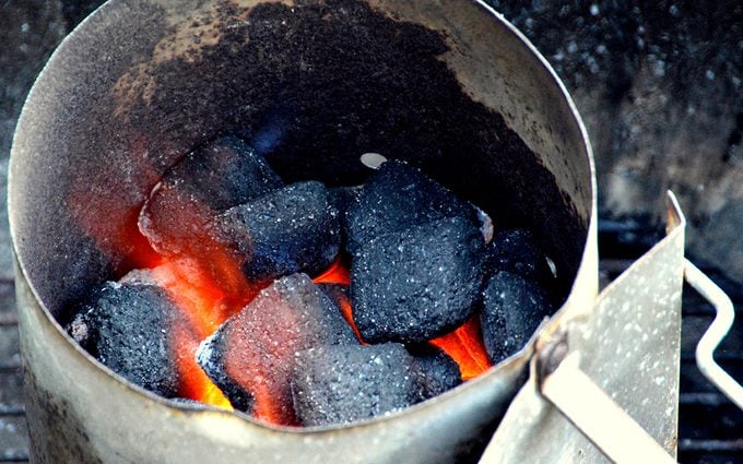 Coal briquettes lit in the barbecue