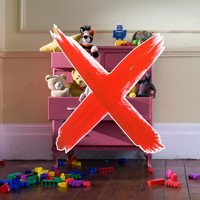 Dresser filled with toys and a red "x" over it