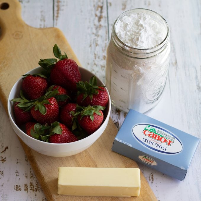 Ingredients for strawberry cream cheese frosting.