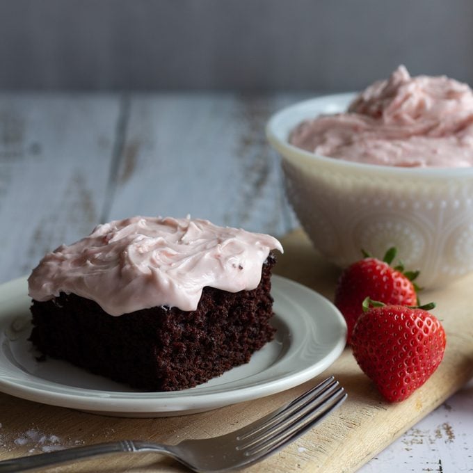 Chocolate cake frosted with strawberry cream cheese frosting.