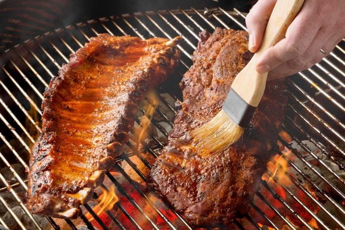 barbecuing ribs on grill