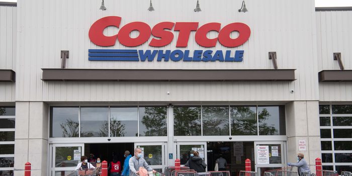 Shoppers walk out with full carts from a Costco store in Washington, DC, on May 5, 2020. - Big-box retailer Costco is limiting consumer purchases of meat in the wake of shutdowns of US processing plants due to the coronavirus.Costco, which has about 440 stores in the United States, is limiting purchases to three items among beef, pork and poultry products, the company said on its website. (Photo by NICHOLAS KAMM / AFP) (Photo by NICHOLAS KAMM/AFP via Getty Images)
