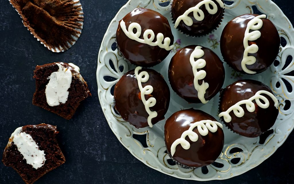 homemade hostess cupcakes with one cut in half to show filling