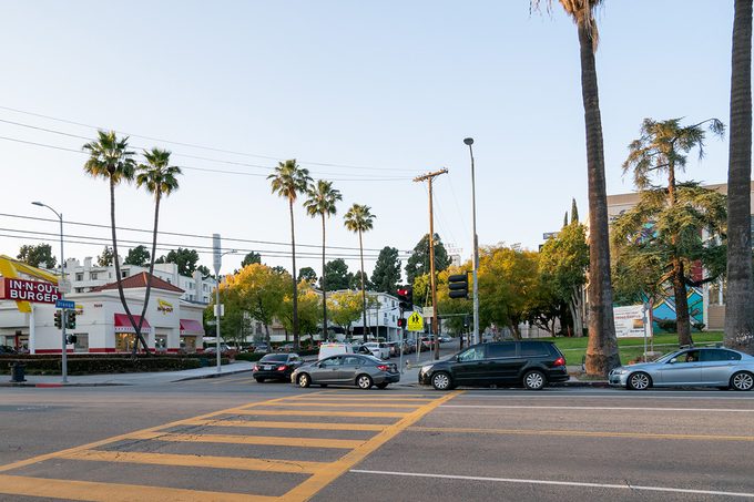 LOS ANGELES, CA - MARCH 26: A general view of the Hollywood In-N-Out Burger on Sunset Blvd during the evening dinner rush, where cars will wait up to an hour to receive drive-thru service after the 'Safer at Home' emergency order was issued by L.A. authorities amid the ongoing threat of the coronavirus outbreak on March 26, 2020 in Los Angeles, California. The World Health Organization declared coronavirus (COVID-19) a global pandemic on March 11th. (Photo by AaronP/Bauer-Griffin/GC Images)