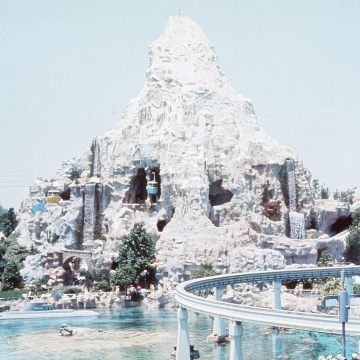 Scenes at the Disneyland theme park in Anaheim, California, United States. Cable cars passinghe Matterhorn mountain attraction and submarine base on the resort. June 1970. (Photo by Monte Fresco/Mirrorpix/Getty Images)