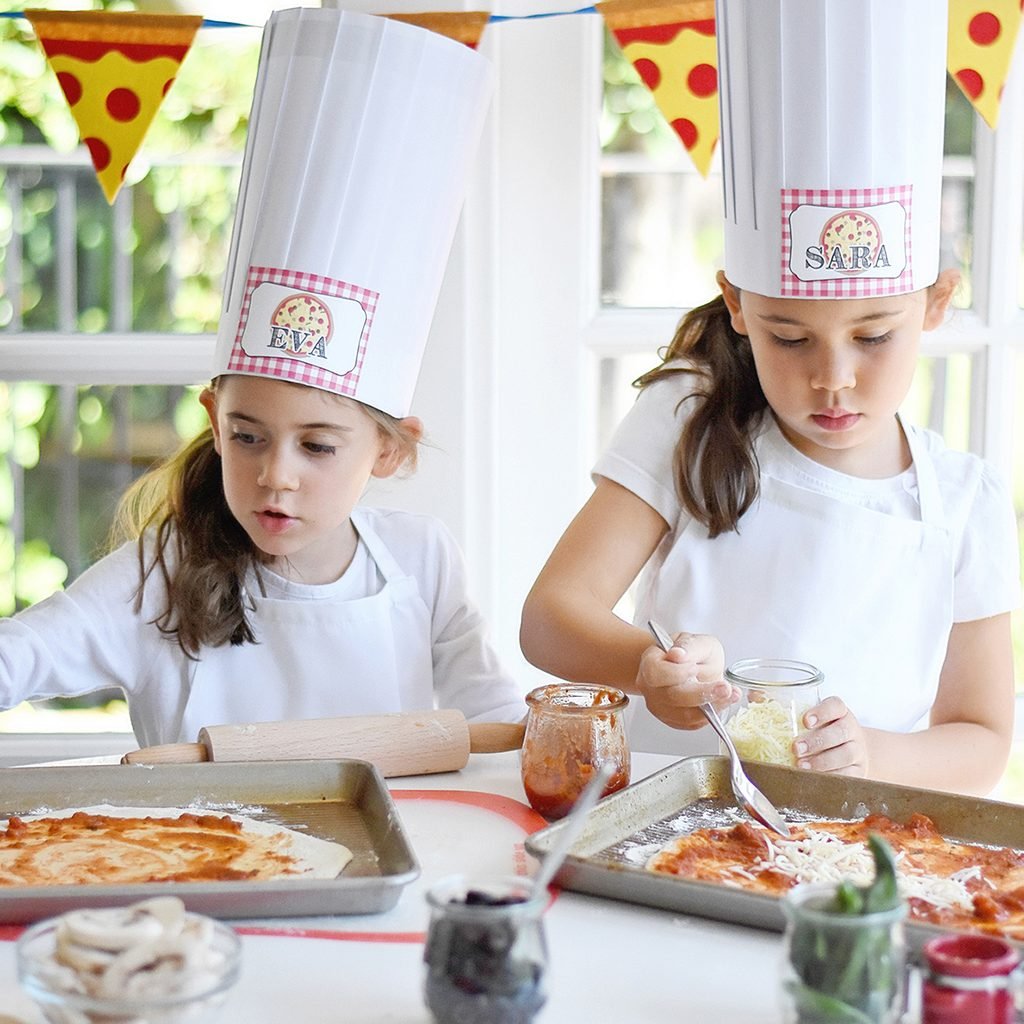 young girls making pizza for Pizza birthday party ideas