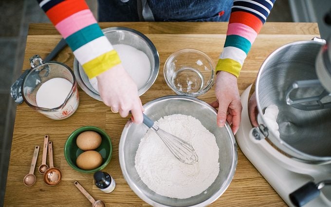 Woman whisking ingredients together