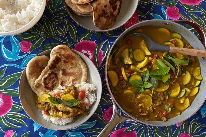 Caraway cookware with summer curry and naan