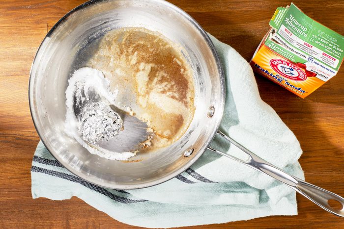 cleaning a pot with foil and baking soda