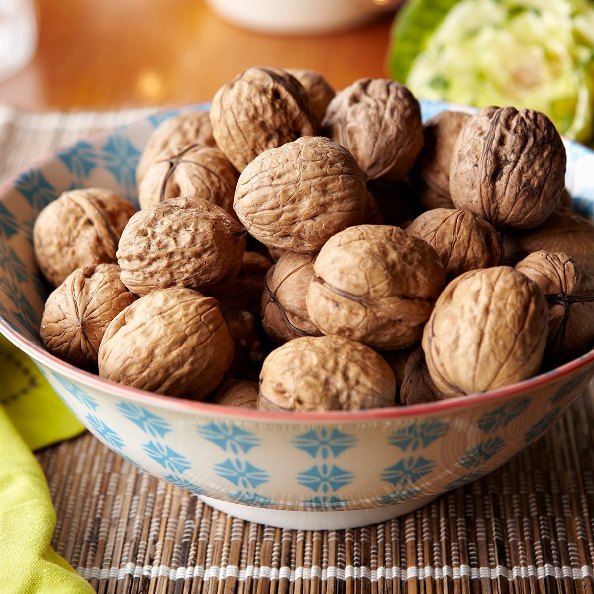 Bowl of walnuts on table