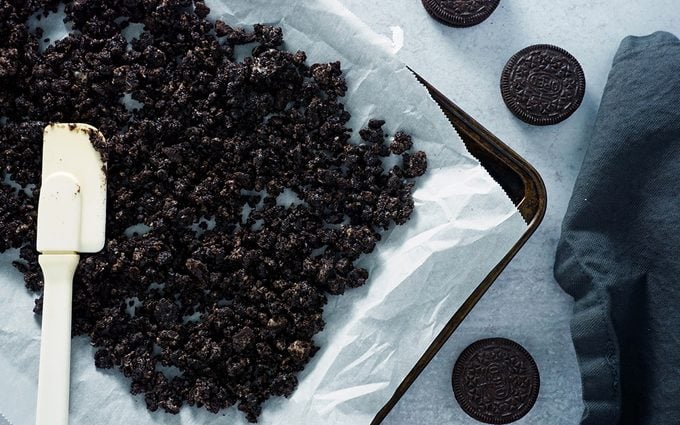 baked oreo cookie crumbles coated in hard shell chocolate for homemade ice cream cake