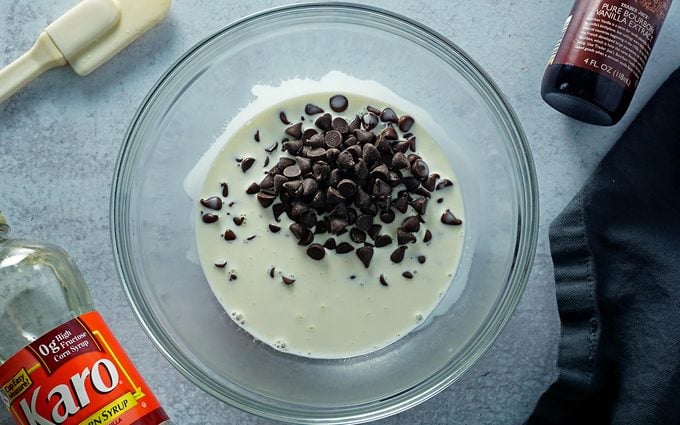 making homemade fudge ganache with cream and semi-sweet chocolate
