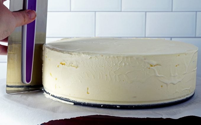 smoothing ice cream with cake smoother after removing springform pan outer ring