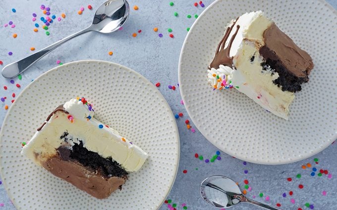 two slices of ice cream cake on plates overhead