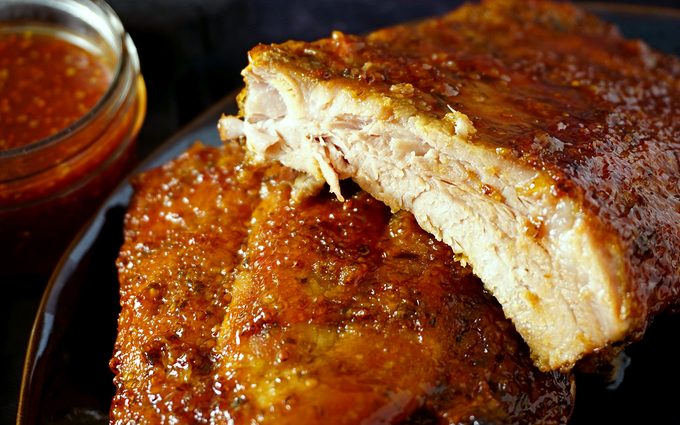 close-up view of juicy baby back ribs baked in the oven