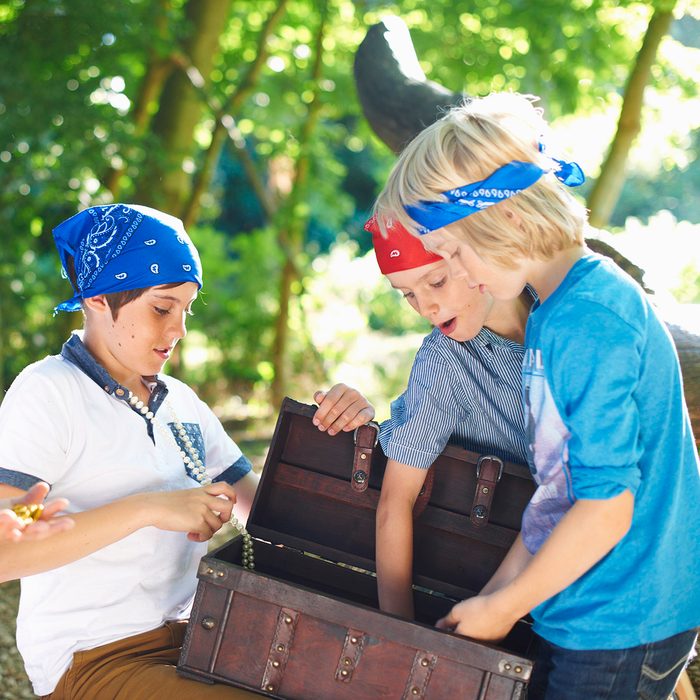 Young boys dressed as pirates with treasure chest