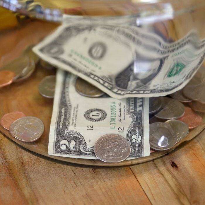 TAOS, NEW MEXICO - MAY 15, 2019: Money in a tip jar in a Taos, New Mexico, coffee shop includes a two dollar bill. (Photo by Robert Alexander/Getty Images)