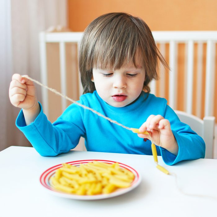 lovely 2 years boy made macaroni beads