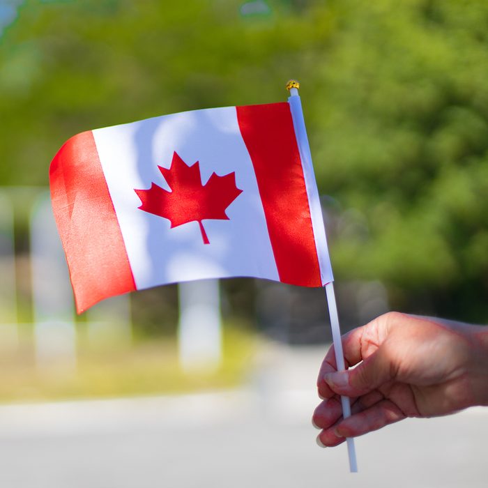 birthday party games for kids Female hand holding canadian flag to celebrate the canada day holiday