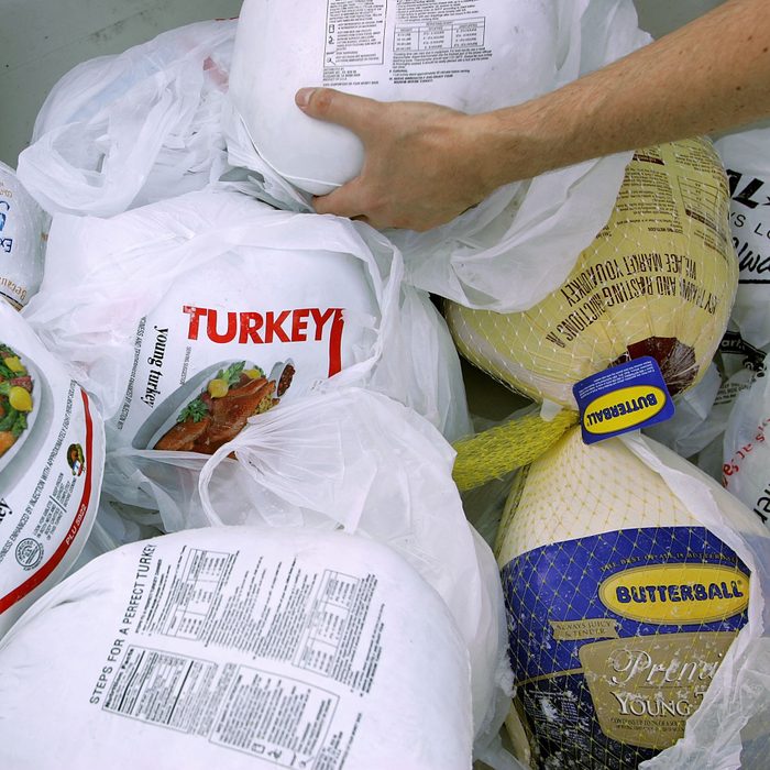 SAN FRANCISCO - NOVEMBER 21: A volunteer prepares a box of turkeys to be given out during the 2006 holiday turkey distribution at the San Francisco Food Bank November 21, 2006 in San Francisco, California. Despite donations being down at most food banks across the country, the San Francisco Food Bank will distribute over 1,500 turkeys to churches and community centers over the holiday season. (Photo by Justin Sullivan/Getty Images)