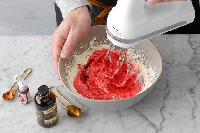 Mixing red velvet cookie batter with hand mixer