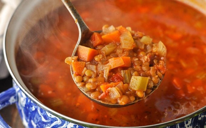 close up of spoon with lentil soup