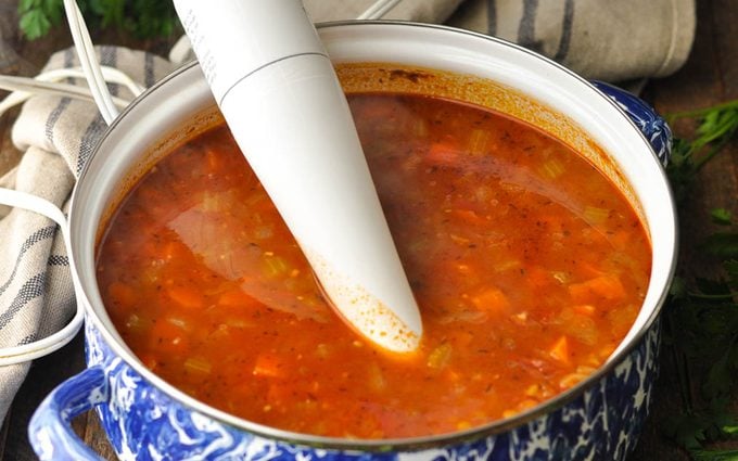 Immersion blender in lentil soup
