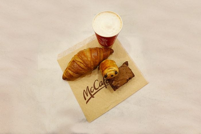 a fresh croissant, chocolate croissant and a gluten free brownie with a cappuccino from Mcdonalds McCafe Restaurant