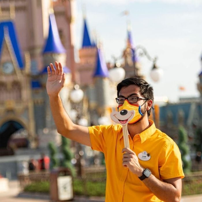 LAKE BUENA VISTA, FL - JULY 11: In this handout photo provided by Walt Disney World Resort, a Disney cast member welcomes guests to Magic Kingdom Park at Walt Disney World Resort on July 11, 2020 in Lake Buena Vista, Florida. July 11, 2020 is the first day of the phased reopening. (Photo by Matt Stroshane/Walt Disney World Resort via Getty Images)