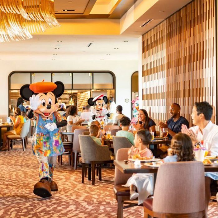 LAKE BUENA VISTA, FL - JUNE 23: In this handout photo provided by Walt Disney World Resort, guests at Disney's Riviera Resort see Mickey Mouse, Minnie Mouse, Donald Duck and Daisy Duck during breakfast at Topolino's Terrace Flavors of the Riviera, the resorts rooftop restaurant on June 23, 2020 in Lake Buena Vista, Florida. During the phased reopening, characters maintain proper physical distancing while parading through the restaurant during mealtimes. Walt Disney World Resort theme parks begin their phased reopening on July 11, 2020. (Photo by Matt Stroshane/Walt Disney World Resort via Getty Images)