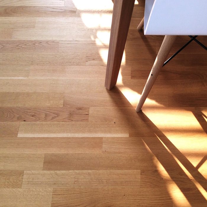 Cropped Image Of Chair On Hardwood Floor