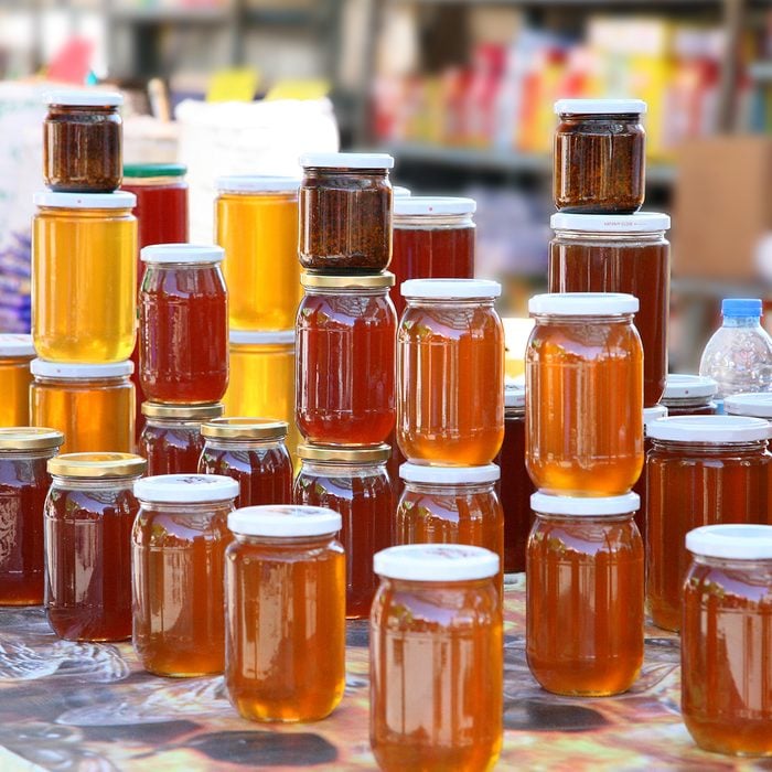 Jars of honey on display for sale.