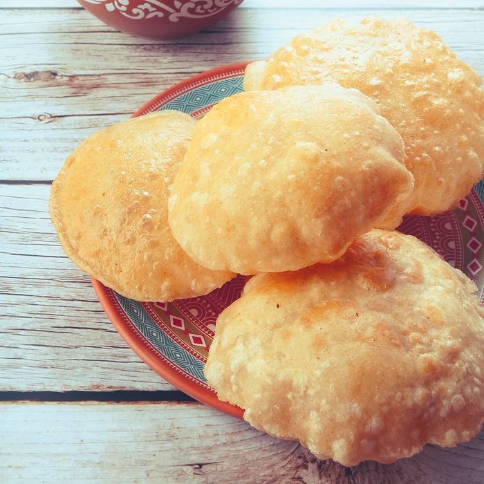 South Indian traditional food Poori or puri with country chicken curry