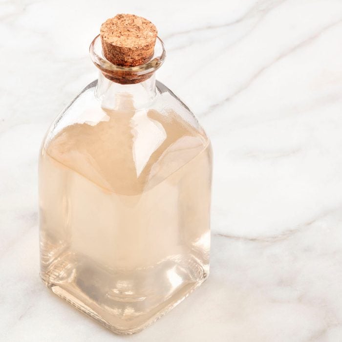 A photo of a corked bottle of homemade rose water face toner with a place for text