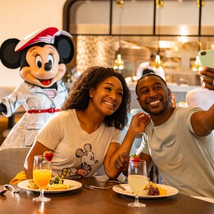 LAKE BUENA VISTA, FL - JUNE 23: In this handout photo provided by Walt Disney World Resort, guests at Disney's Riviera Resort see Mickey Mouse, Minnie Mouse, Donald Duck and Daisy Duck during breakfast at Topolino's Terrace Flavors of the Riviera, the resorts rooftop restaurant on June 23, 2020 in Lake Buena Vista, Florida. During the phased reopening, characters maintain proper physical distancing while parading through the restaurant during mealtimes. Walt Disney World Resort theme parks begin their phased reopening on July 11, 2020. (Photo by Matt Stroshane/Walt Disney World Resort via Getty Images)
