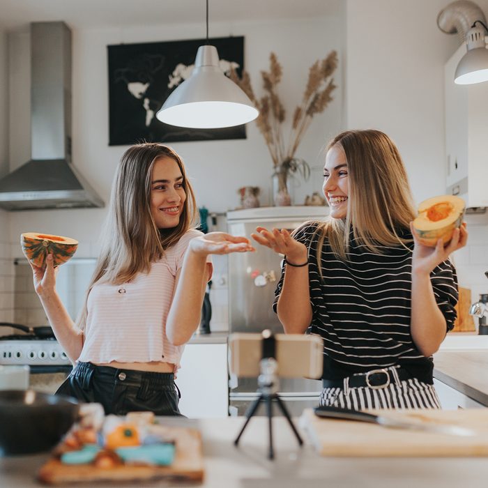 SCROLL, COOK, REPEAT​ Food Trends Report, Photo series of two female teenage vegan vloggers filming a show about cooking vegan foods.