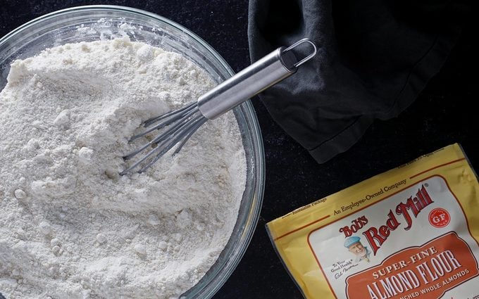 blending almond flour and powdered sugar for black forest uncake