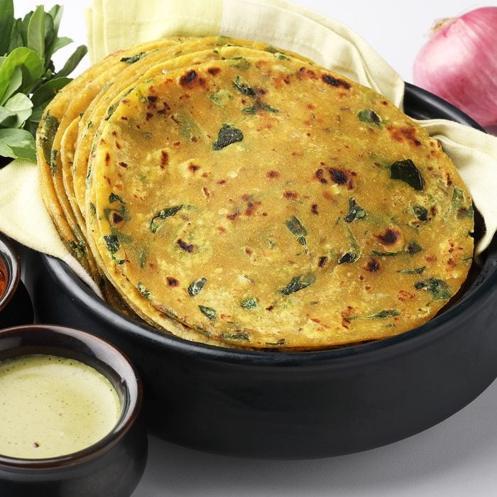 Methi Paratha (Thepla) / Indian flat bread using fenugreek leaves, served with mint dip,yogurt.