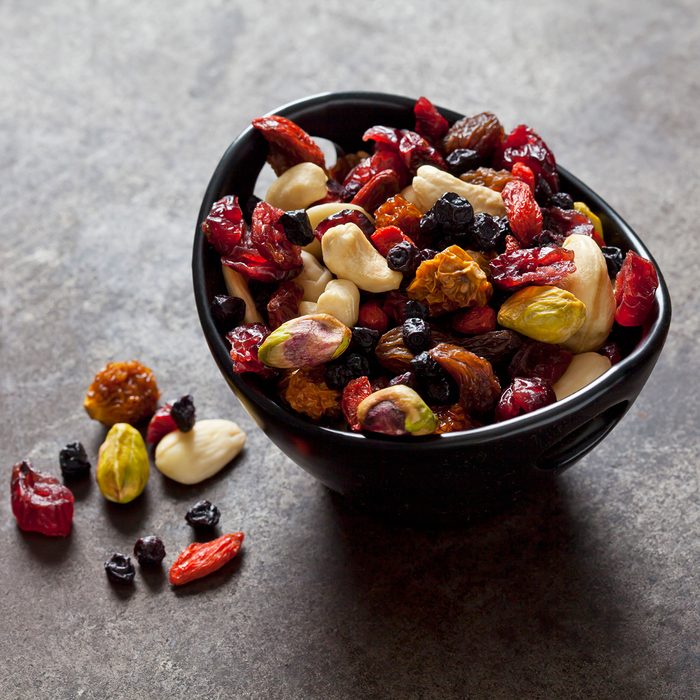 Bowl of dried fruits, pistachios, cashew nuts and almonds