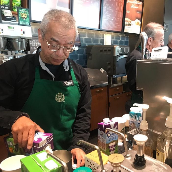 30 October 2018, Mexico, Mexiko-Stadt: Miguel Angel Martinez Sarmiento works as a barista in a branch of the US coffee house "Starbucks" and pours milk into a can. All the employees at the coffee shop, which opened in Del Valle Sur at the beginning of September, are over 60 years old. (to dpa "US coffee house operates senior branch in Mexico City" from 01.11.2018) Photo: Antonia Märzhäuser/dpa (Photo by Antonia Märzhäuser/picture alliance via Getty Images)