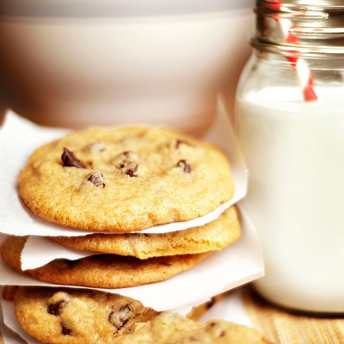 Close-up of cookies and milk on table