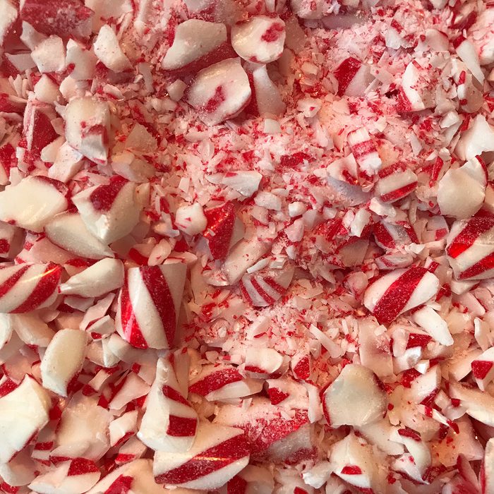 Close up of crushed peppermint candy ready to be mixed with chocolate to make peppermint bark.