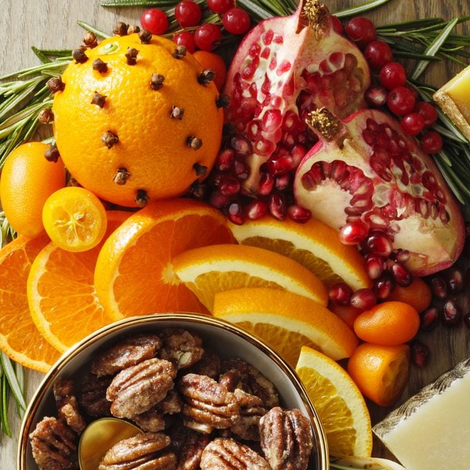 Festive Holiday Cheese Board Oranges Kumquats And Pomegranates