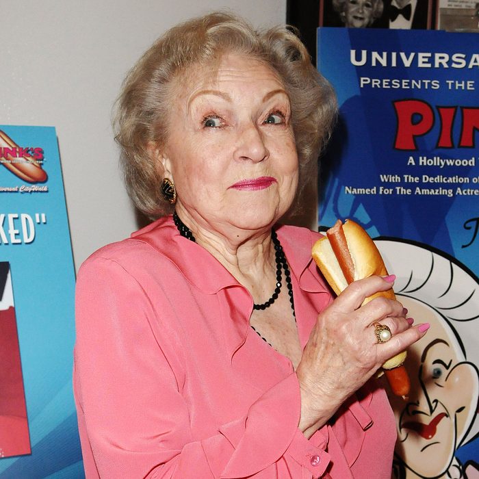 Betty White eating a hot dog