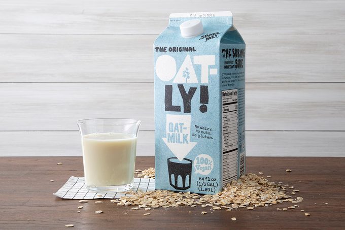 Oatly Oat Milk With Glass And Oats