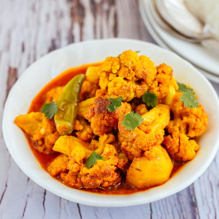 indian main dishes Cauliflower Potato Curry in a Bowl - Popular Indian Curry Aloo Gobi