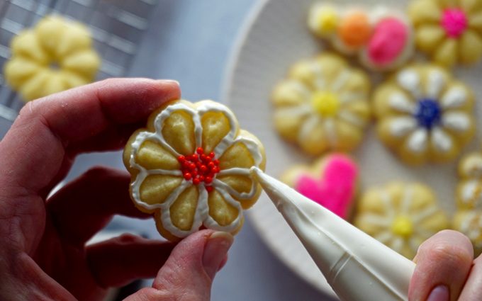 Use a small knife or piping bag to decorate the cookies with icing. how to make butter cookies