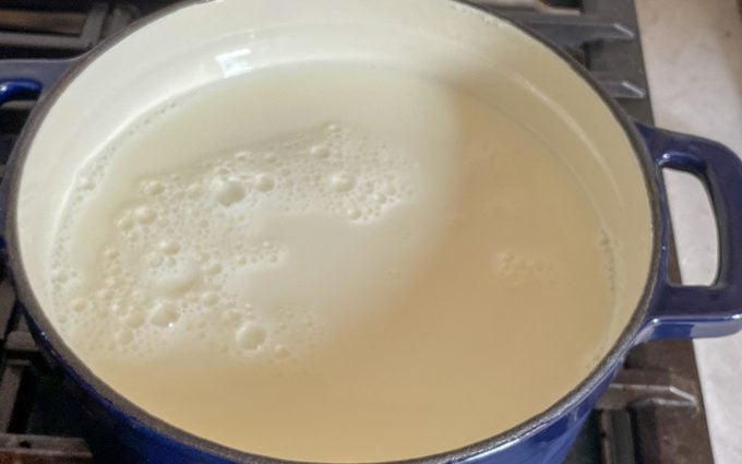 milk inside the dutch oven ready to be boiled