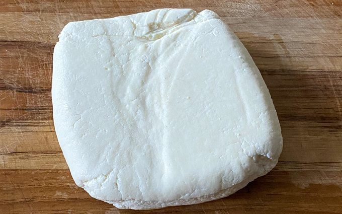 firm and set paneer on a cutting board