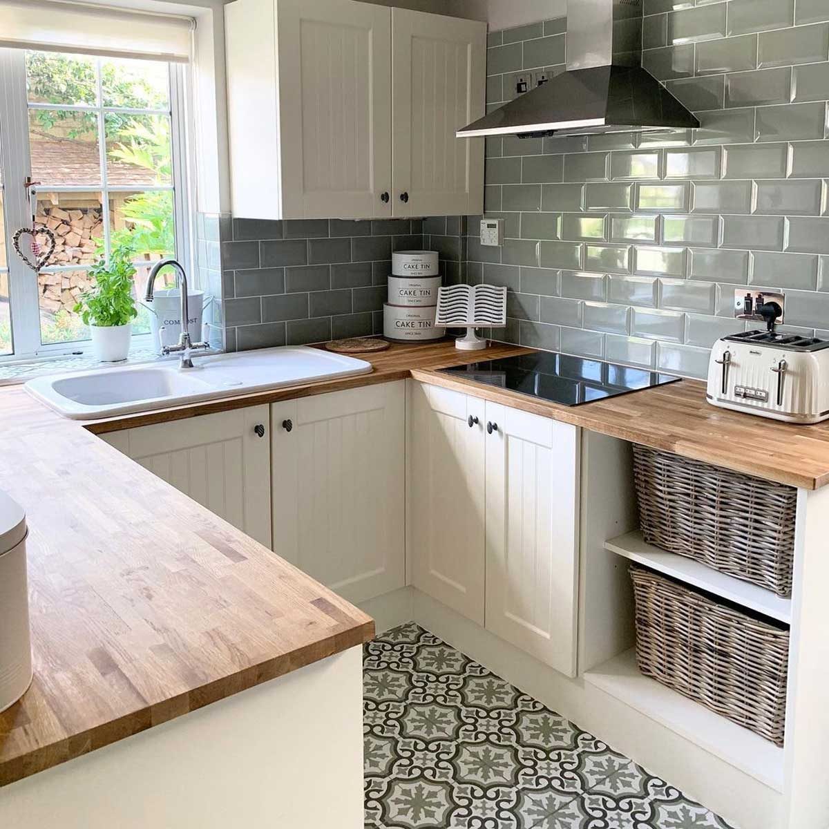 Kitchen with patterned floor tiles